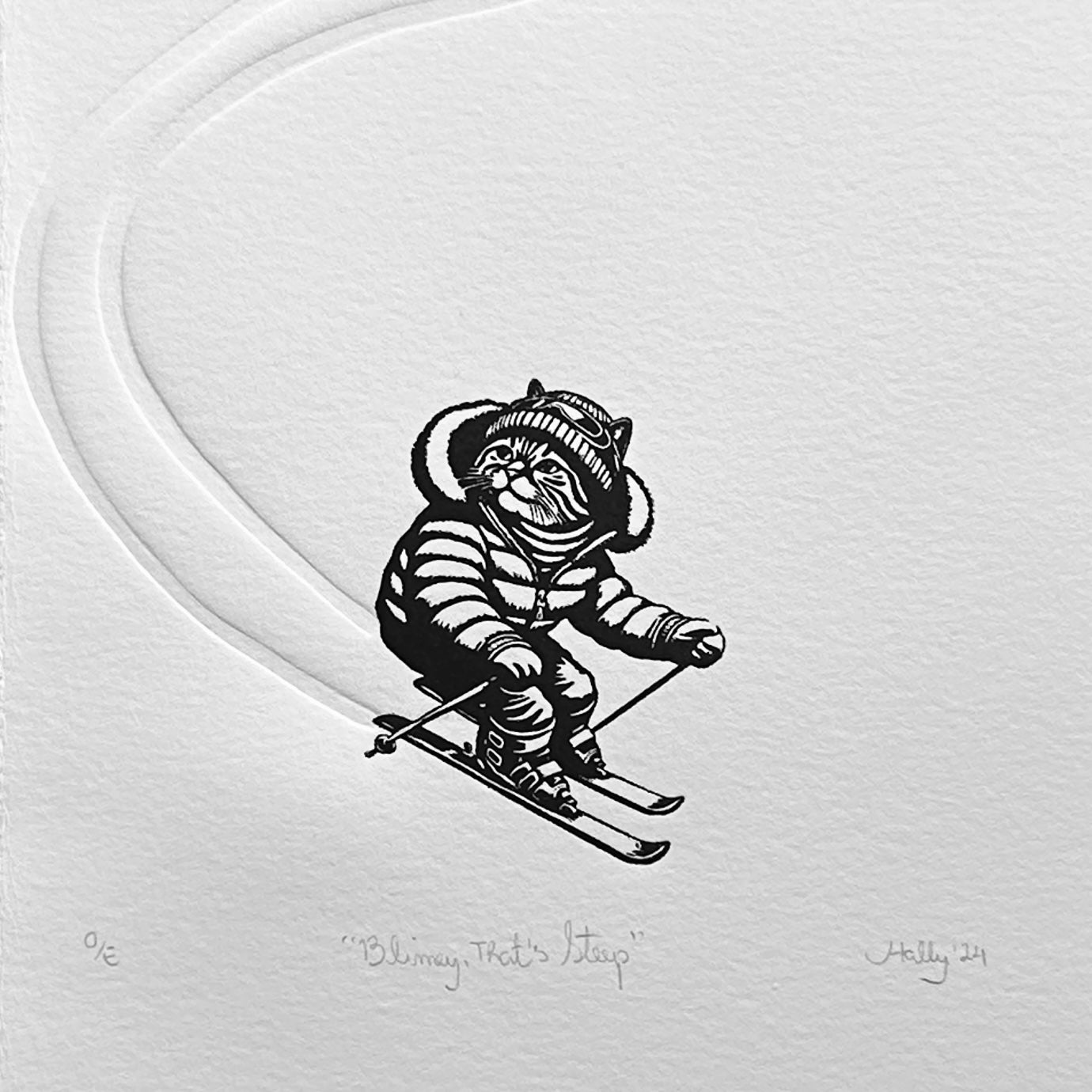 A cat dressed in ski gear descending a snowy mountain, this black and white linocut print perfect for ski lovers and cat lovers alike. The freshly made tracks in the snow are embossed into the paper.