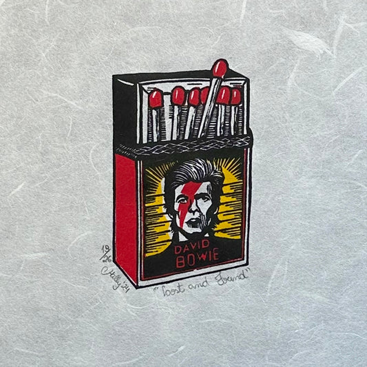 David Bowie image a match box, in three colours and a bold image. This handmade linocut print makes the perfect gift for music lovers and those that adore David Bowie.