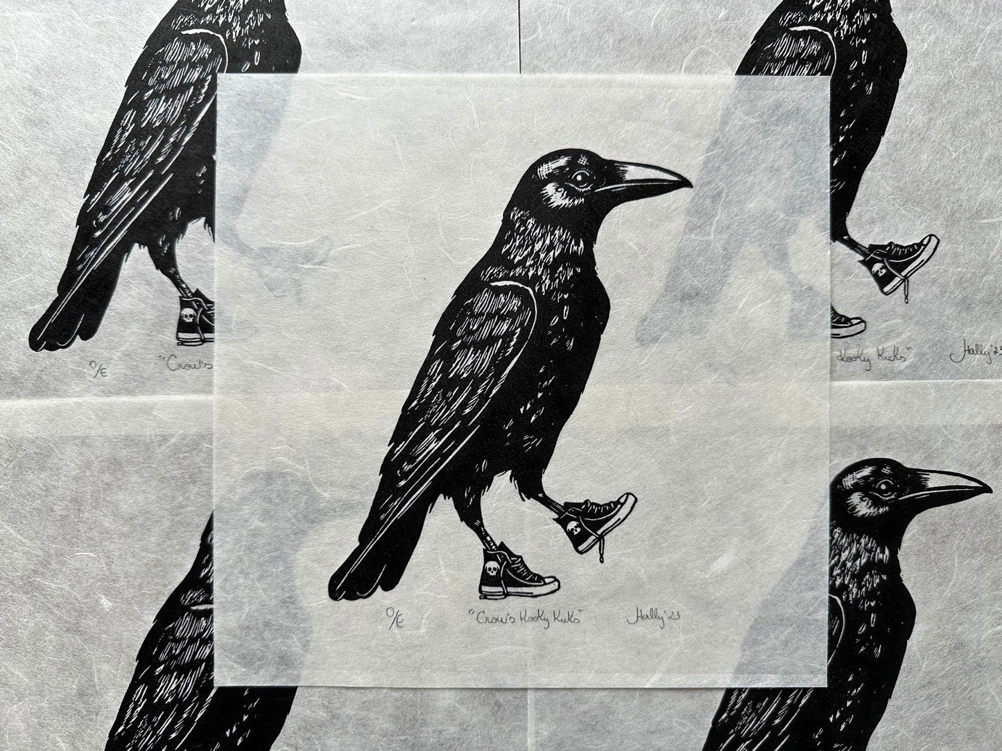 Linocut print of a crow standing upright, wearing sneakers. The crow is detailed with bold, black ink lines, and its kicks/sneakers/trainers add a playful, whimsical touch to the artwork.